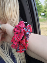 Load image into Gallery viewer, watermelon seed print scrunchie on wrist beside mixed berry print scrunchie
