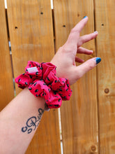 Load image into Gallery viewer, two watermelon seed scrunchies on wrist