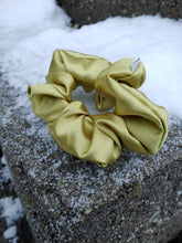Load image into Gallery viewer, golden silky scrunchie on stone surface