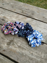 Load image into Gallery viewer, assortment of scrunchies on table