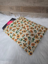Load image into Gallery viewer, Floral patterned booksleeve on a white fluffy surface
