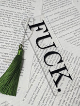 Load image into Gallery viewer, Clear 2 by 6 inch arcylic bookmark with silky tassel on a metal chain black FUCK. design in a flat lay photo
